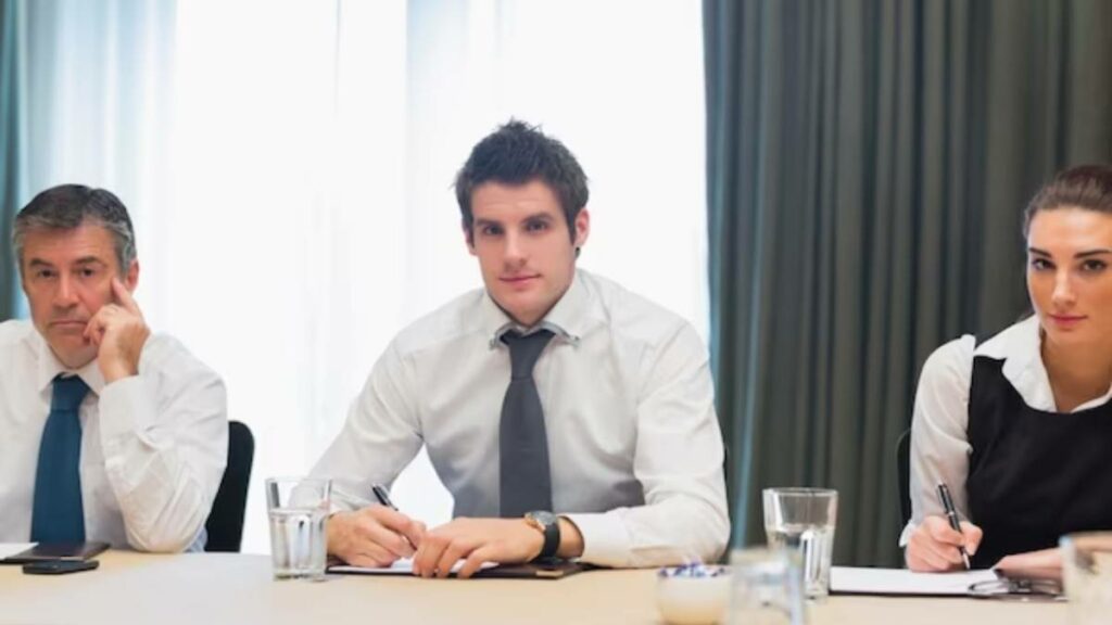 Business professionals engaged in a meeting or interview in a professional setting